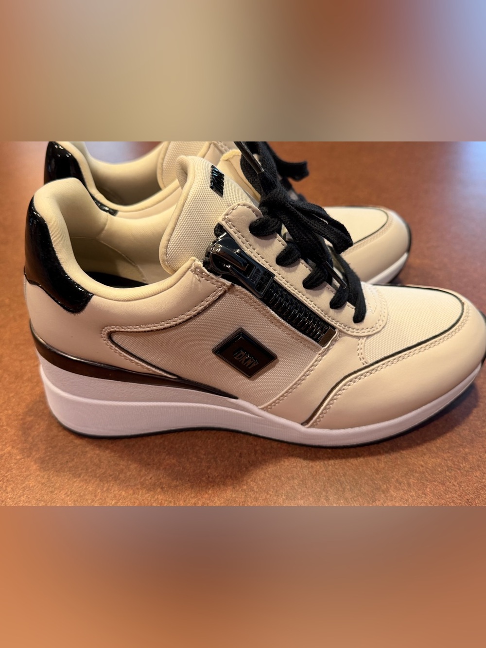 DNKY Kaden womenโs lace up wedge sneakers with side zipper